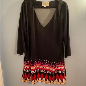 Black tunic with patterned hemline